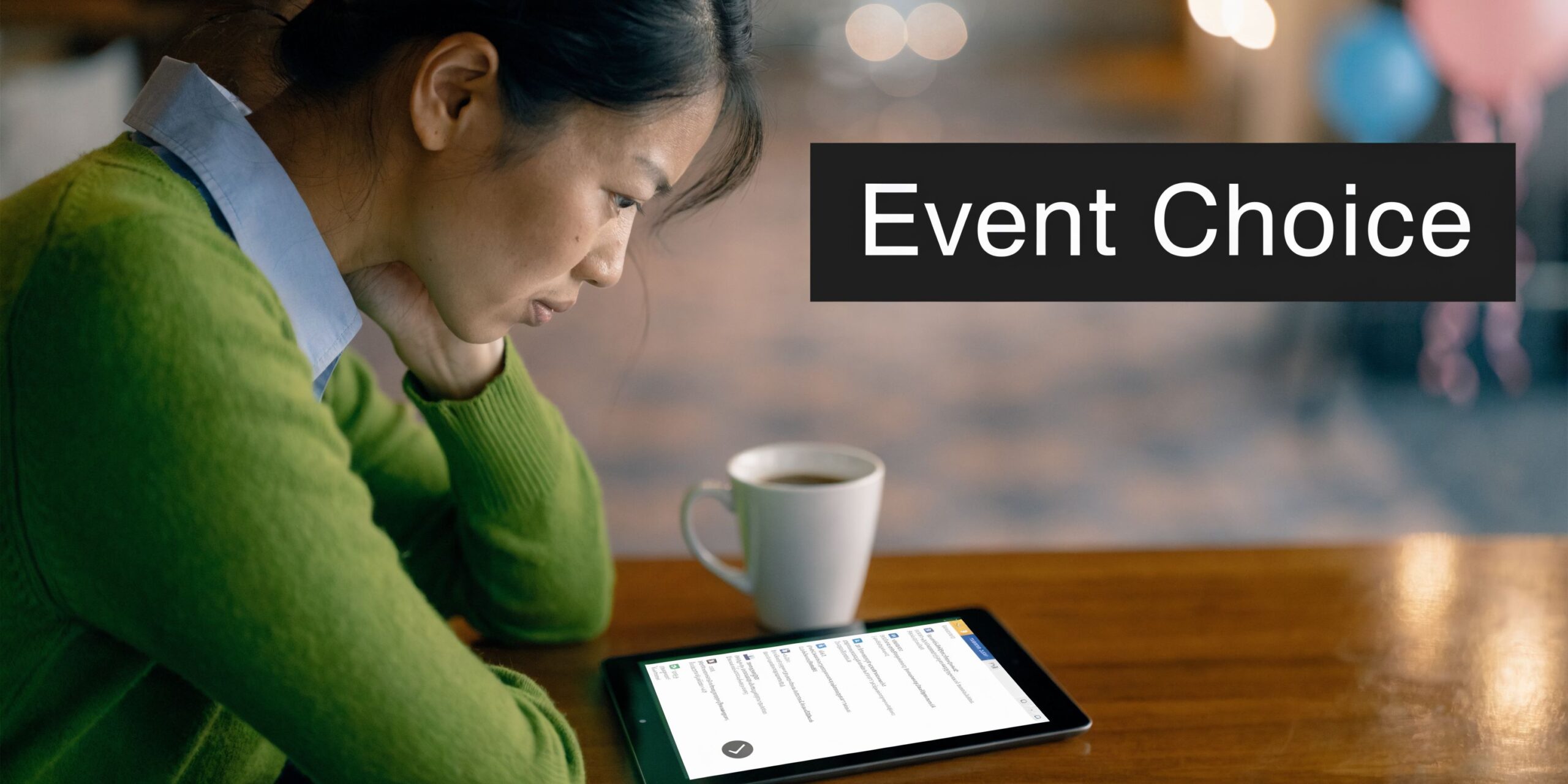 A woman looks at an 80s tribute band event selection menu on a tablet at a table.